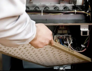 person changing ac filter