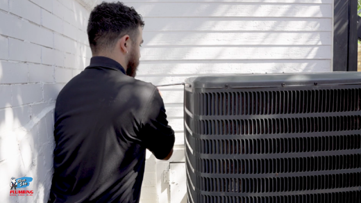 employee with AC unit